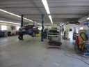 Professional vehicle lifting equipment at Sunshine Collision Center, located at Boca Raton, FL, 33431, allows our damage estimators a clear view of all collision related damages.