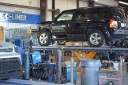 Professional vehicle lifting equipment at Atlantic Collision Inc., located at Port Saint Lucie, FL, 34983, allows our damage technicians a clear view of what might be causing the problem.