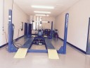 Professional vehicle lifting equipment at Car Guys Collision Repair - Corporate, located at Lady Lake, FL, 32159, allows our damage estimators a clear view of all collision related damages.