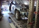 Professional vehicle lifting equipment at Geer Brothers Body Shop, located at Huntington, WV, 25774, allows our damage technicians a clear view of what might be causing the problem.