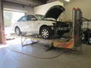 Professional vehicle lifting equipment at Hughes Auto Body & Paint , located at Santa Barbara, CA, 93111, allows our damage estimators a clear view of all collision related damages.
